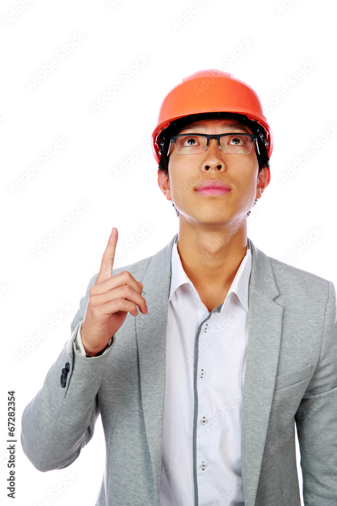 Asian engineer man point up isolated on white background Asian engineer man point up isolated on white background