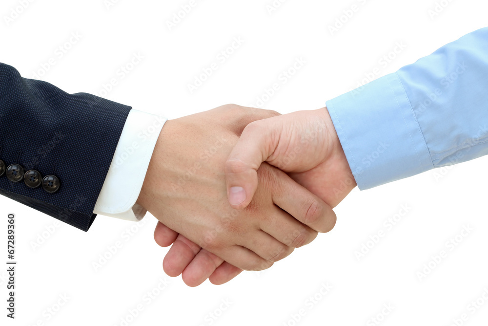 Close-up image of a firm handshake between two colleagues on a Close-up image of a firm handshake between two colleagues on a