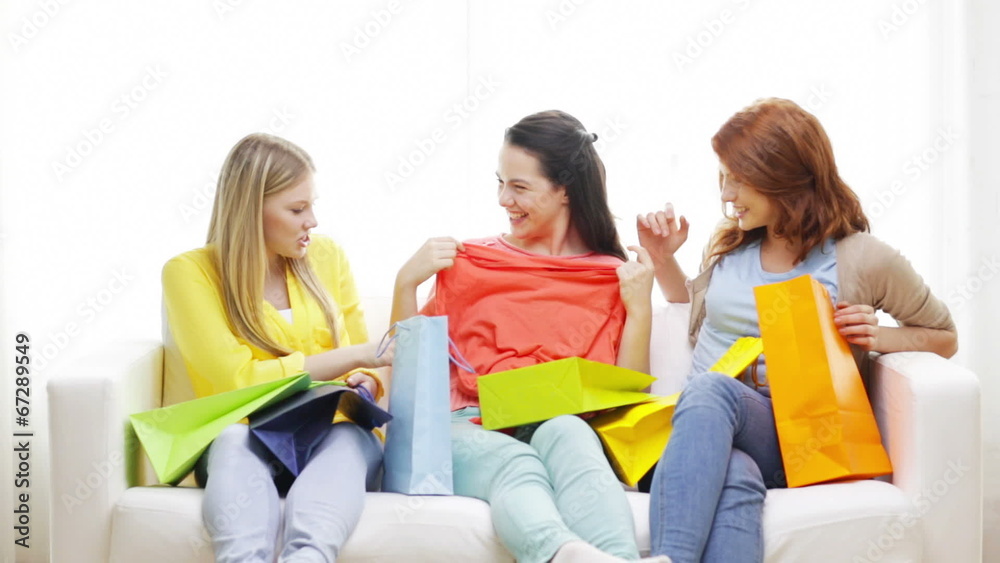 smiling teenage girls with many shopping bags smiling teenage girls with many shopping bags