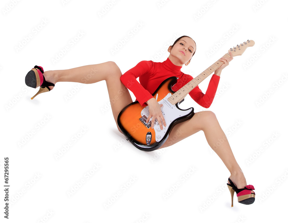 Sexy young female posing with guitar over white