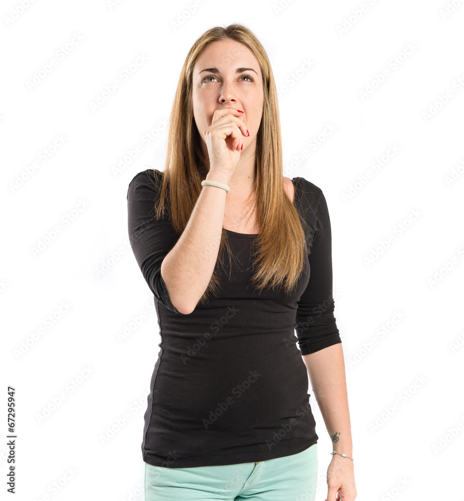 Blonde girl thinking over isolated white background Blonde girl thinking over isolated white background