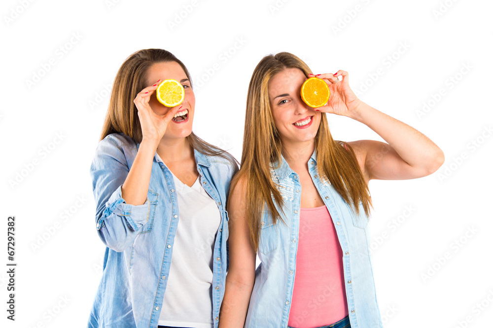 Girl playing with fruits over white background Girl playing with fruits over white background