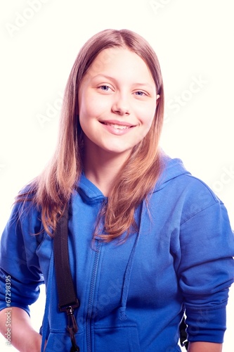 Teen girl standing with schoolbag