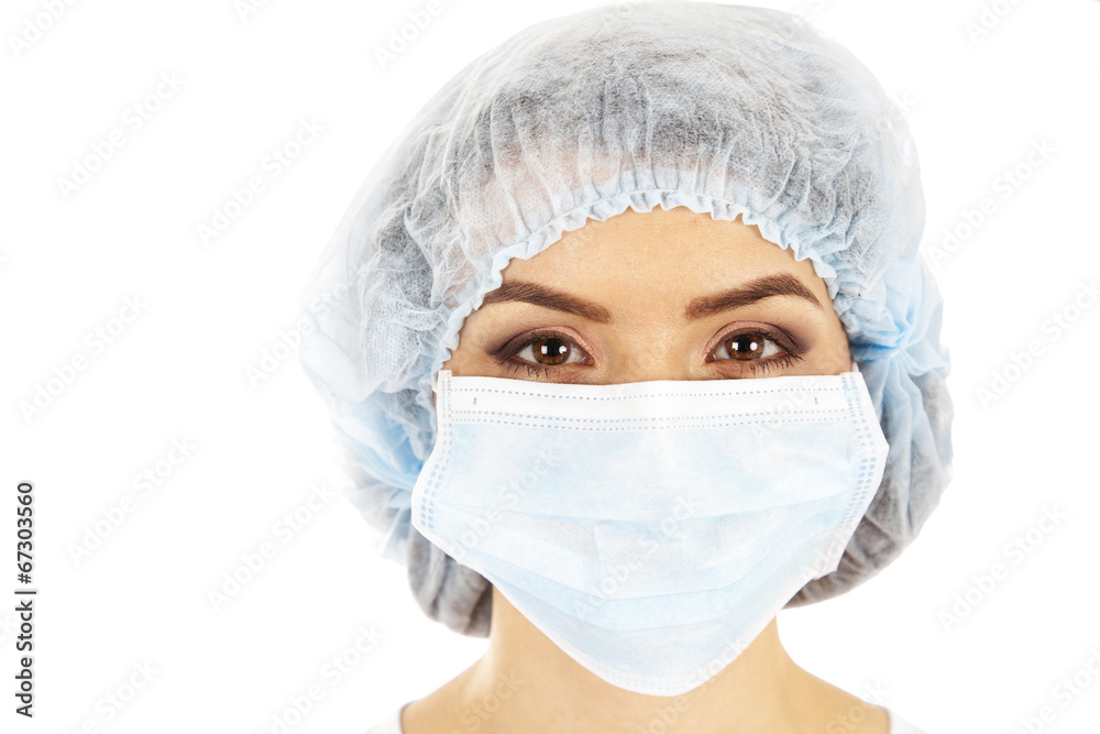 female doctor in a mask closeup. female doctor in a mask closeup.