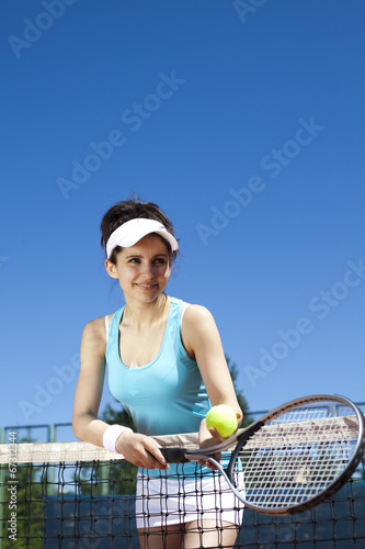  Girl playing tennis on the court