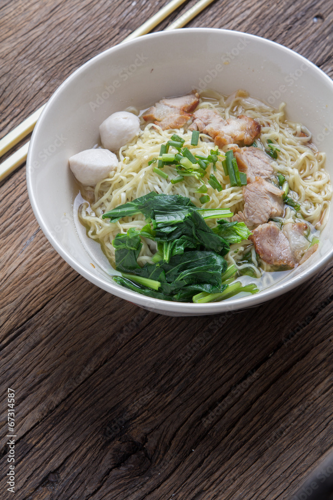 Noodles bowl on wooden background Noodles bowl on wooden background
