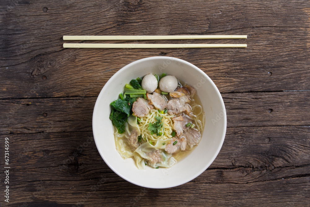 Noodles bowl on wooden background Noodles bowl on wooden background