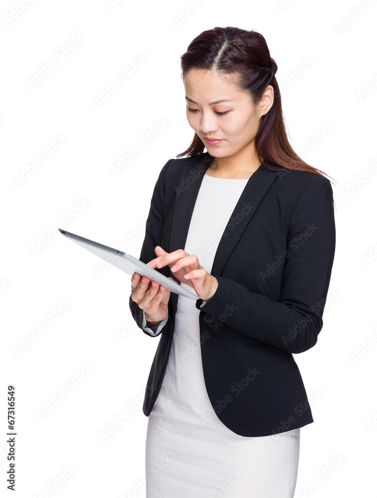 Asian business woman look at digital tablet Asian business woman look at digital tablet