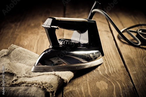 Vászonkép Old electric iron, touch-up in retro style