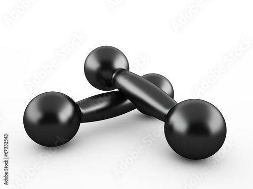 Two black pig-iron dumbbells isolated on a white background