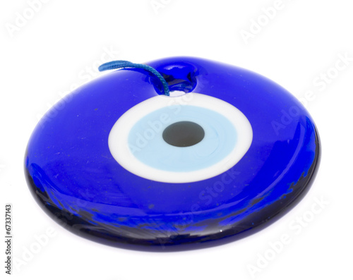 Glass Turkish eye on white background photo