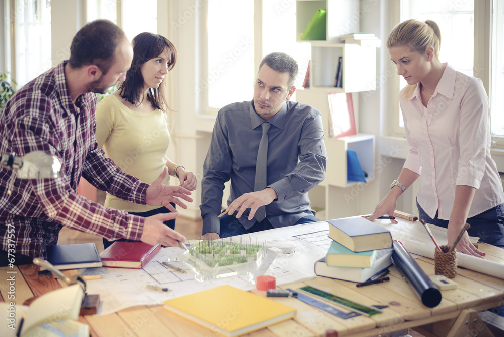 Group of Architects Sitting Around Table Having Meeting Group of Architects Sitting Around Table Having Meeting