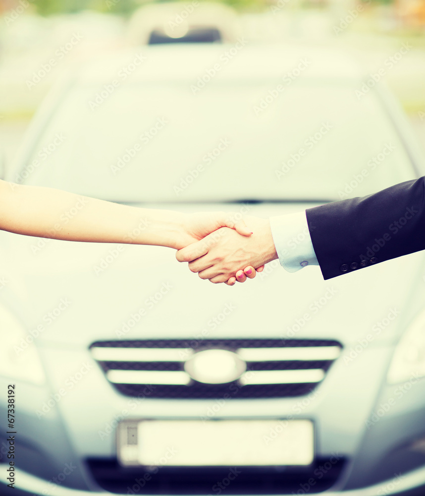 customer and salesman shaking hands customer and salesman shaking hands