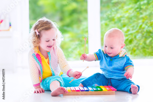 Kids playing music with xylophone
