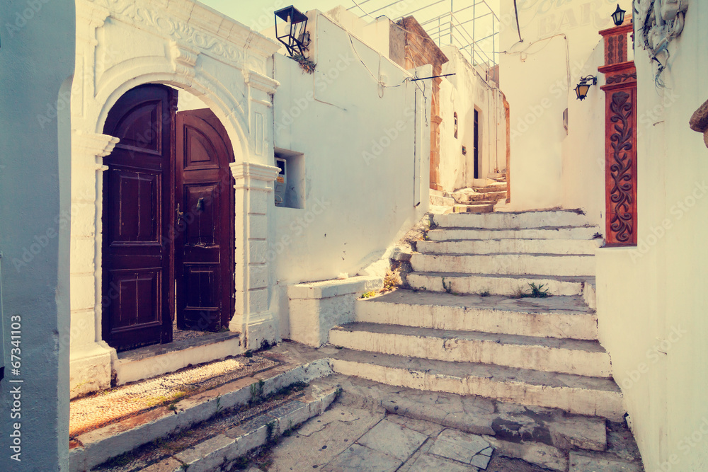 Naklejka premium vintage photo of narrow street in Lindos. Rhodes, Greece