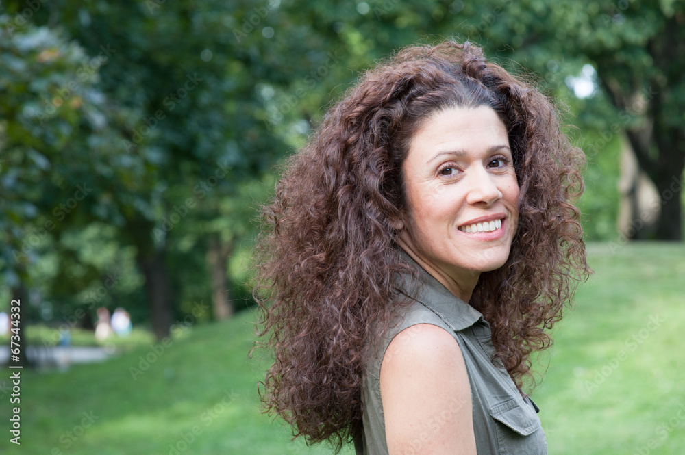 Headshoot of young woman in the park Headshoot of young woman in the park