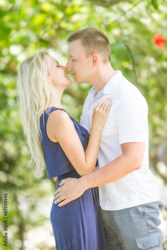 young loving couple on natural background
