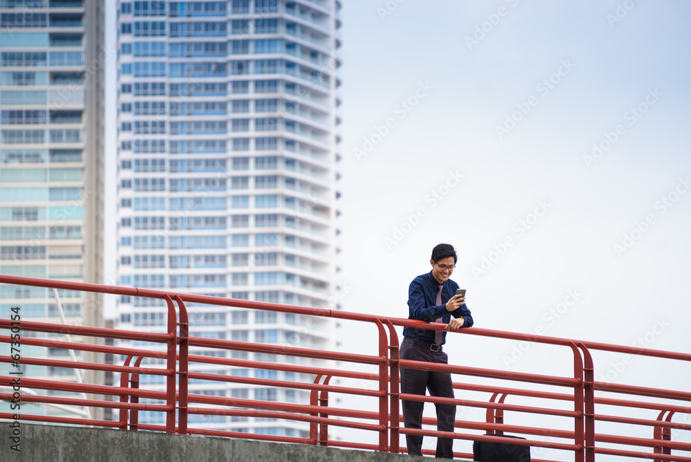 Portrait of asian office worker texting on mobile phone Portrait of asian office worker texting on mobile phone