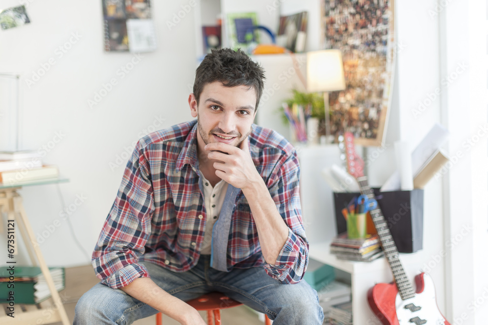 Fototapeta premium portrait of an handsome young man in his flat