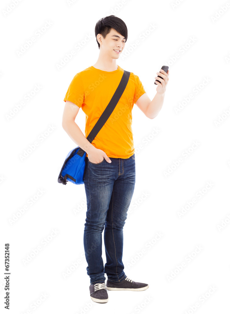 young student watching a smart phone with white background young student watching a smart phone with white background