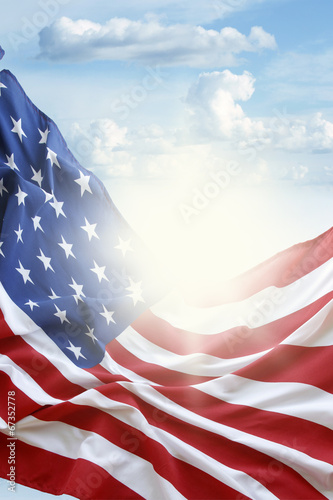 American flag in blue sky