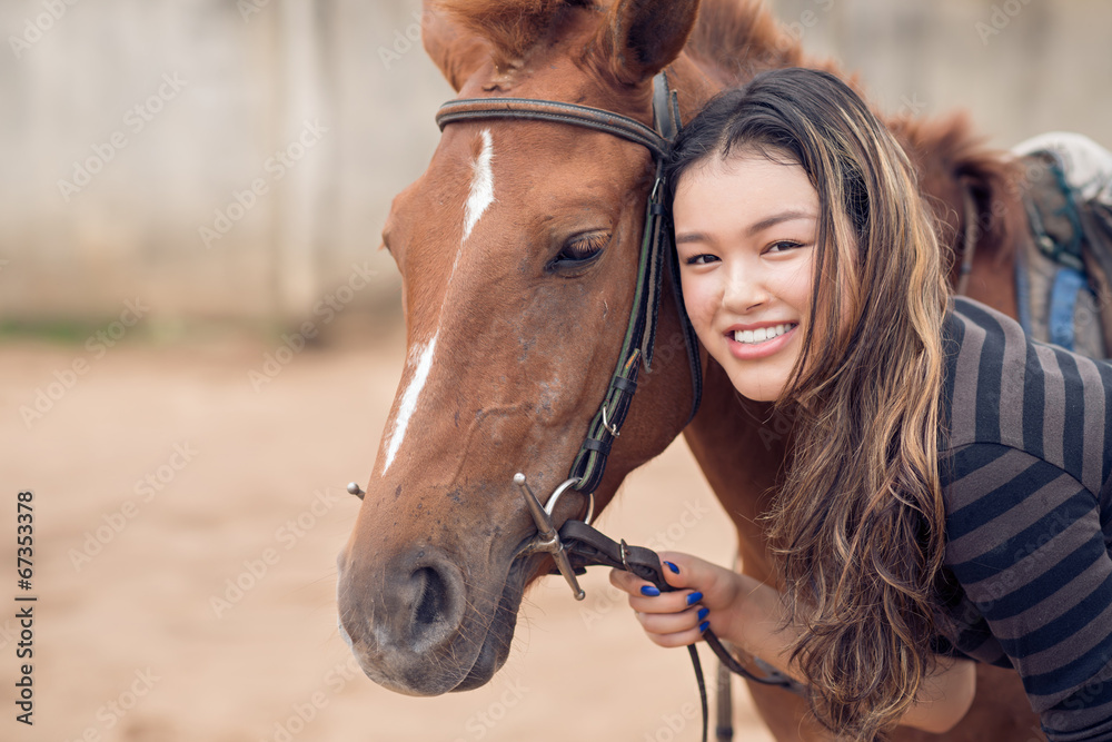 Obraz premium Chestnut pony and girl