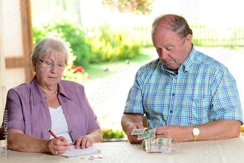 older couple calculating her little budget