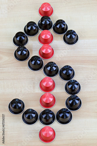 Single-serve coffee capsules in a shape of Dollar Sign photo