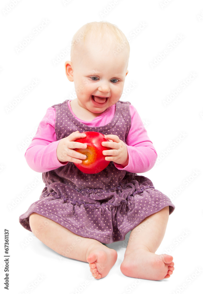 Smiling girl sitting with an apple in his hand Smiling girl sitting with an apple in his hand