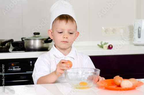 Young boy earning to be a chef