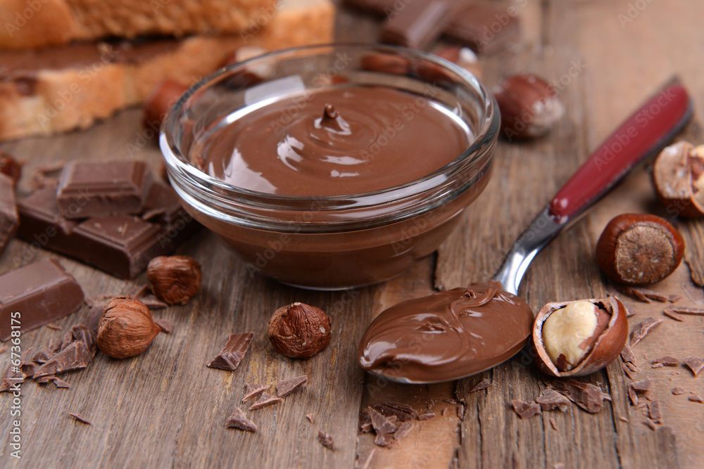 Sweet chocolate cream in bowl on table close-up Sweet chocolate cream in bowl on table close-up