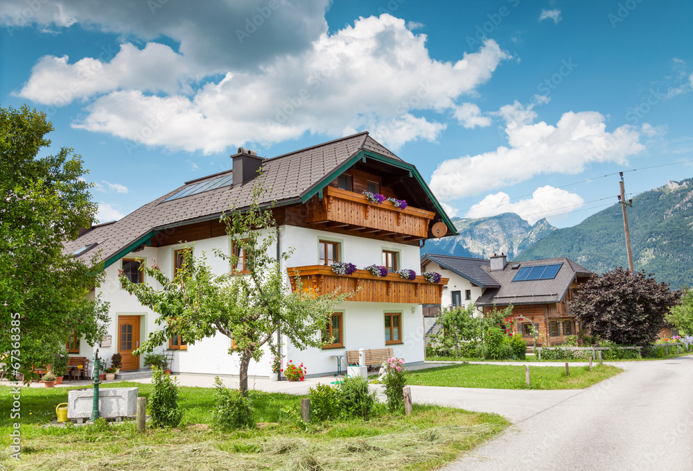 Traditional Alpine house in the mountains Traditional Alpine house in the mountains