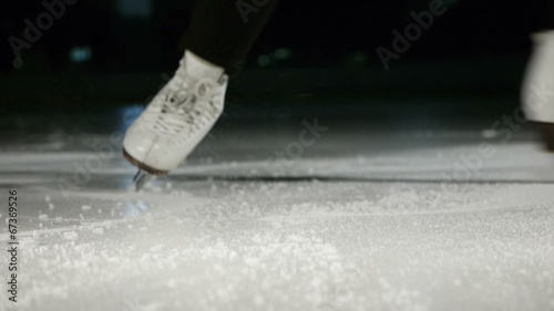 figure skating white skates stopping