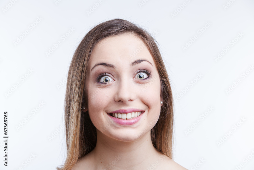 Fototapeta premium Young woman looking surprised. white background