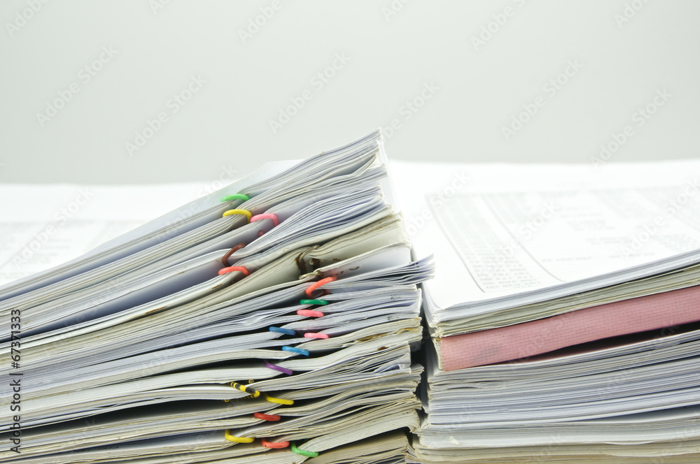 Close up stack document of account at side of wall Close up stack document of account at side of wall