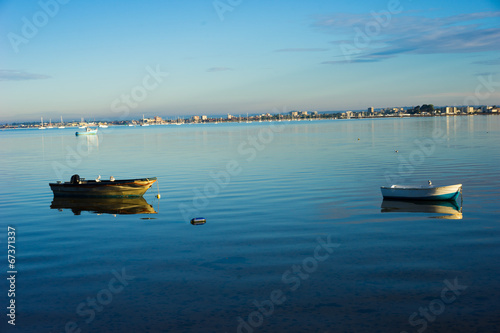 Two moored small motor boats on a calm sea © stryjek
