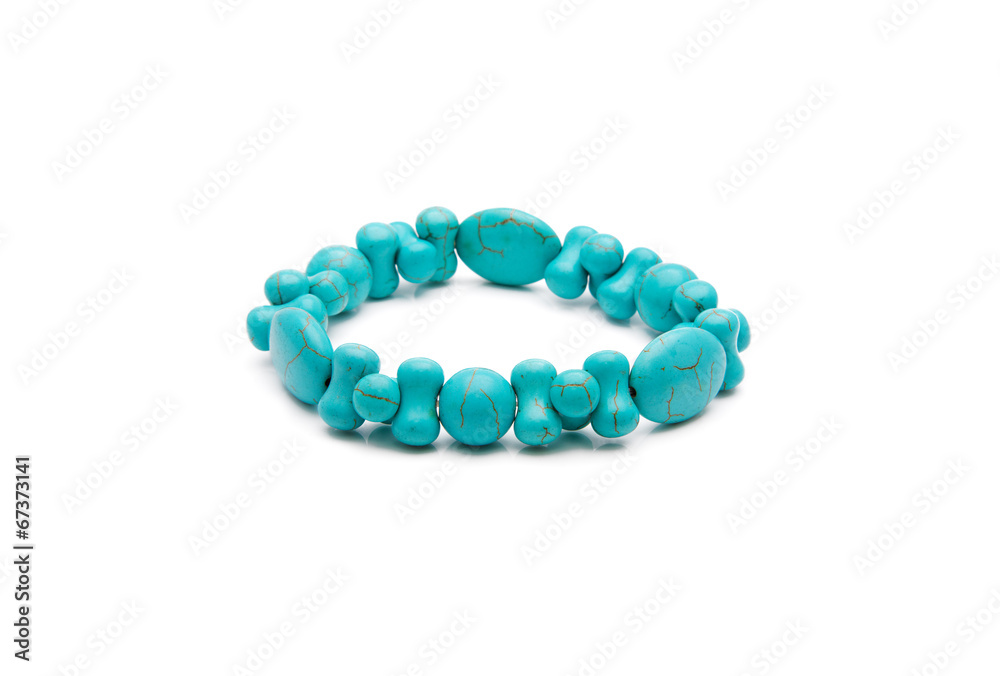 Bracelet from turquoise stone isolated on a white background Bracelet from turquoise stone isolated on a white background