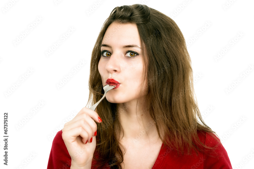 Portrait of young smiling woman with spoon in her mouth and Portrait of young smiling woman with spoon in her mouth and
