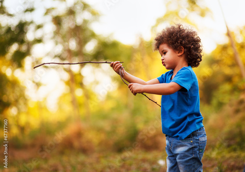 Cute mixed race boy, in nature