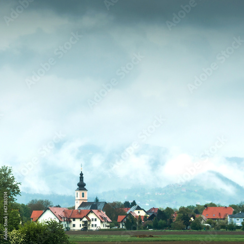 Church on the hill in the Alps photo