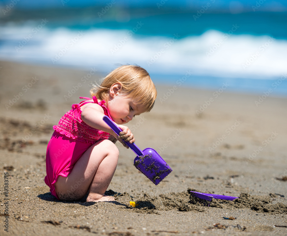 little cute girl playing in the sand little cute girl playing in the sand