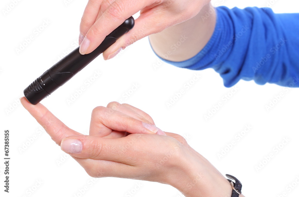 Hand of woman using lancet on finger. White background Hand of woman using lancet on finger. White background