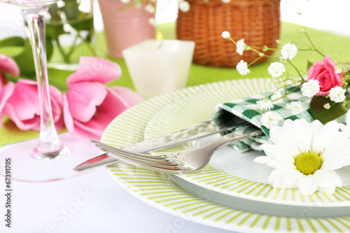 Table setting with spring flowers close up