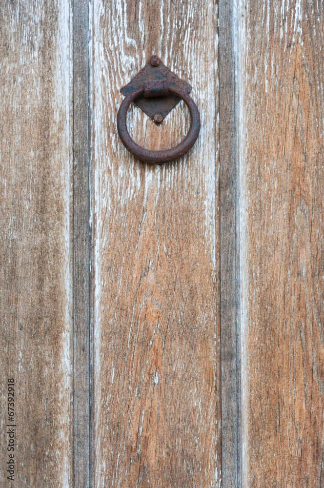 Close up of rustic iron door knocker Close up of rustic iron door knocker