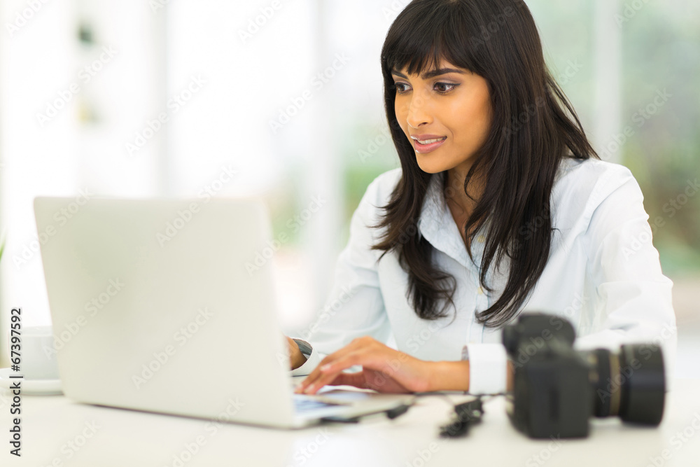 female photographer working on computer female photographer working on computer