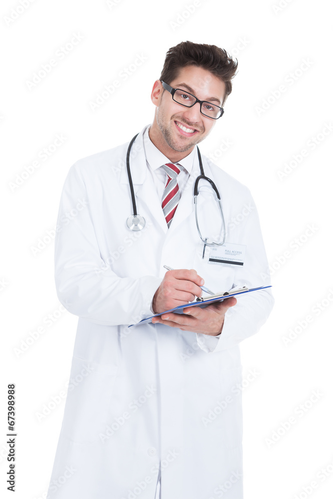 Male Doctor Writing On Clipboard