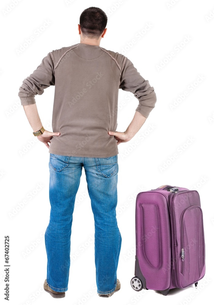 Fototapeta premium traveling young man with suitcas