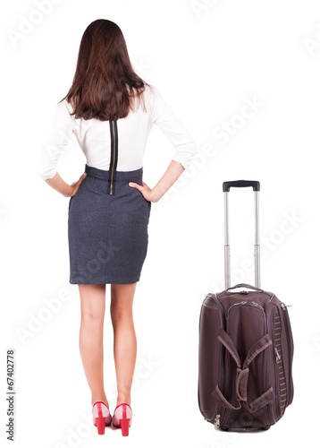 back view of traveling business woman with suitcas.