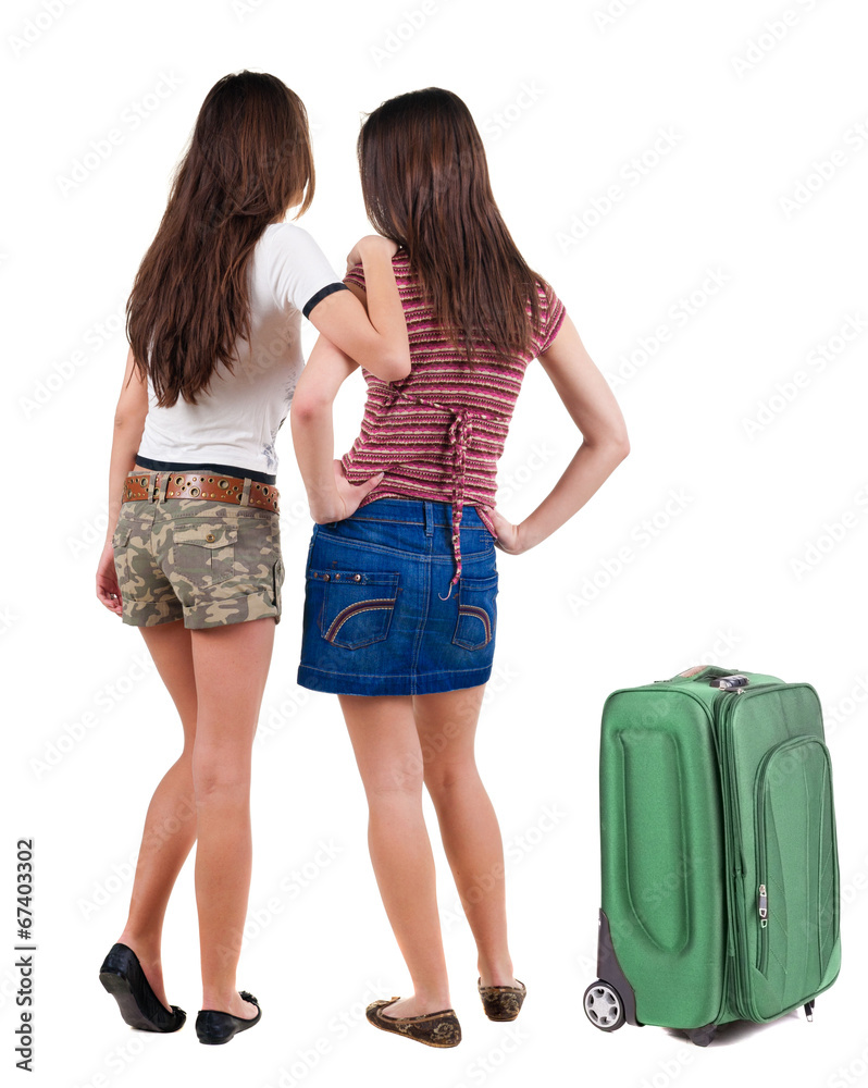 Two young women friend traveling with suitcas . Two young women friend traveling with suitcas .