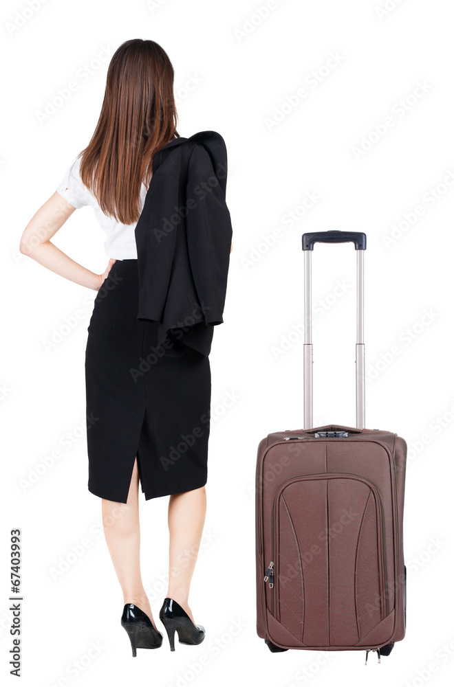 back view of thoughtful business woman traveling with suitcas. back view of thoughtful business woman traveling with suitcas.